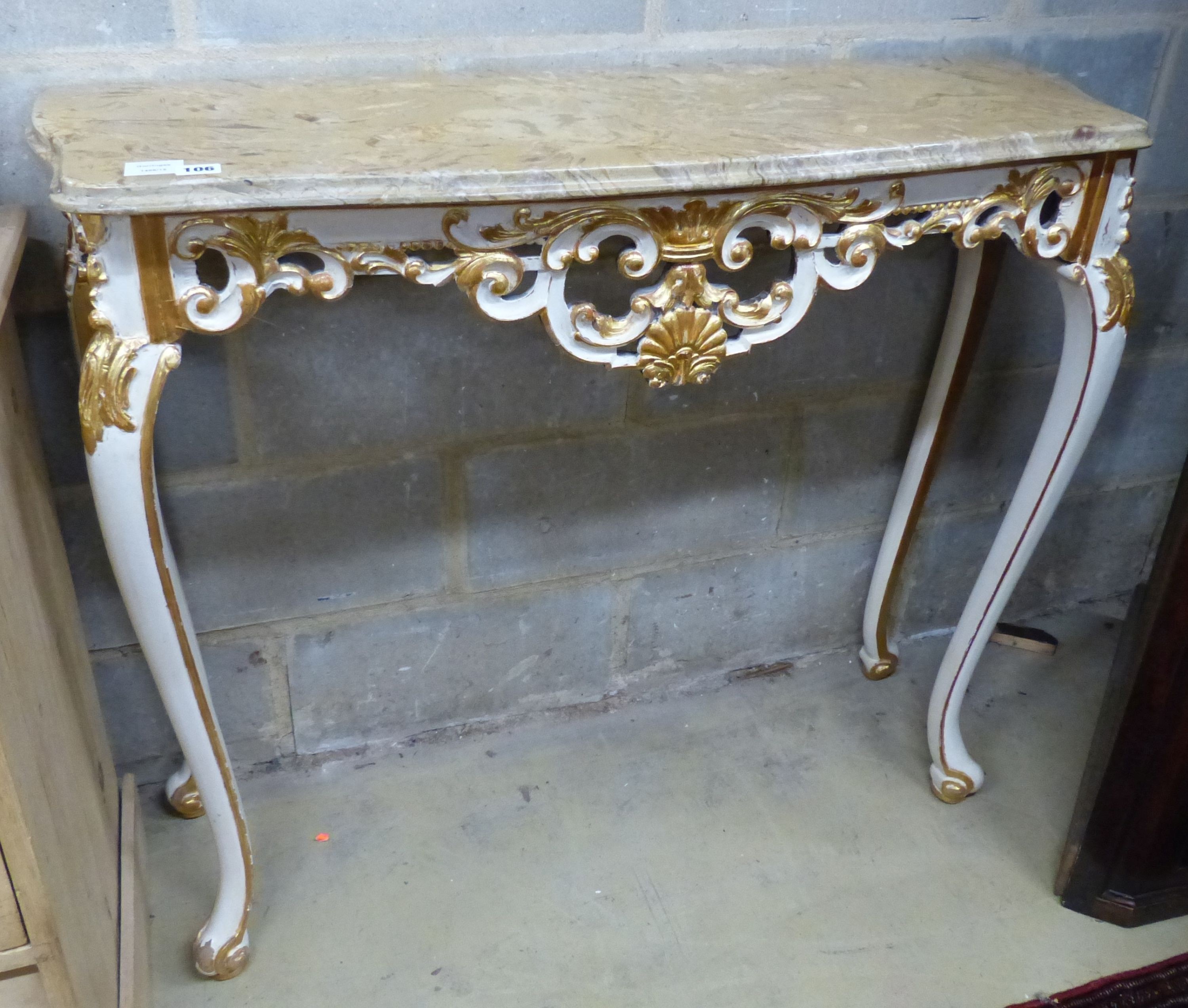 A 20th century Italian marble topped console table with pierced carved painted and giltwood base, W.102cm D.34cm H.89cm